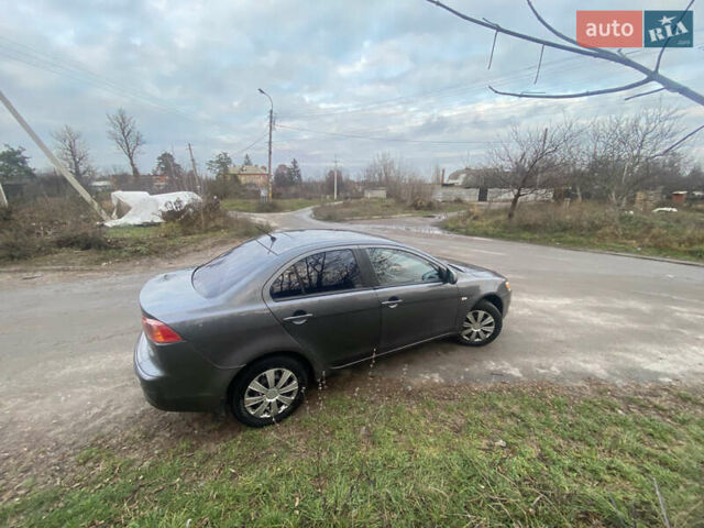 Серый Мицубиси Лансер, объемом двигателя 1.5 л и пробегом 255 тыс. км за 6500 $, фото 18 на Automoto.ua