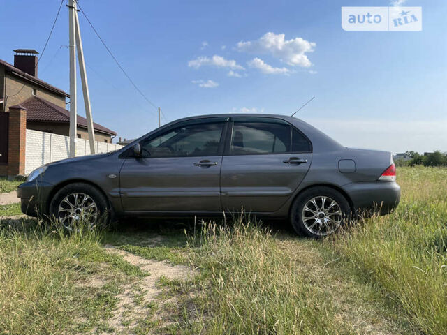 Сірий Міцубісі Lancer, об'ємом двигуна 1.6 л та пробігом 165 тис. км за 5200 $, фото 7 на Automoto.ua