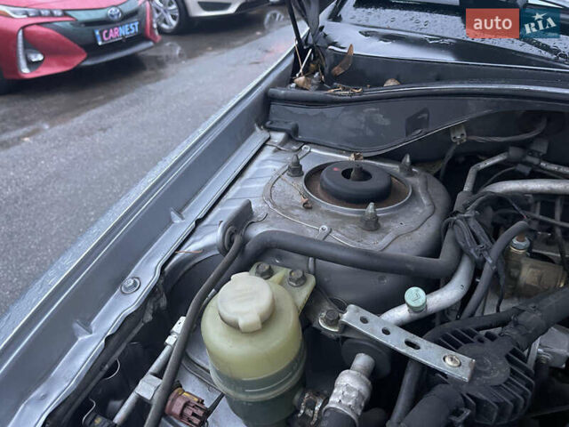 Сірий Міцубісі Lancer, об'ємом двигуна 1.58 л та пробігом 220 тис. км за 5900 $, фото 12 на Automoto.ua