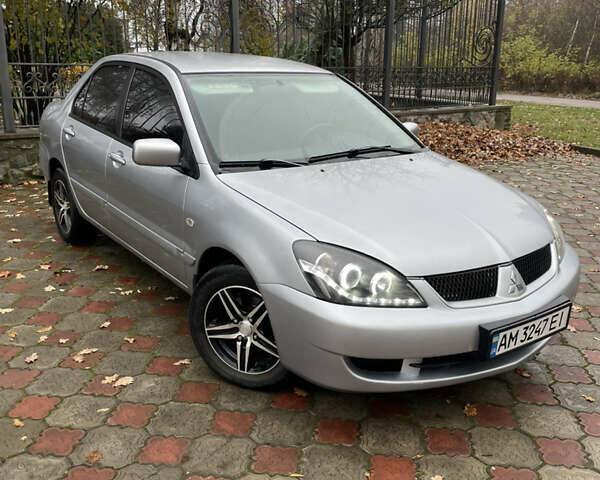 Сірий Міцубісі Lancer, об'ємом двигуна 1.59 л та пробігом 219 тис. км за 4500 $, фото 3 на Automoto.ua