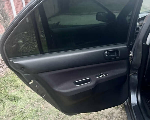 Сірий Міцубісі Lancer, об'ємом двигуна 1.58 л та пробігом 186 тис. км за 3500 $, фото 8 на Automoto.ua