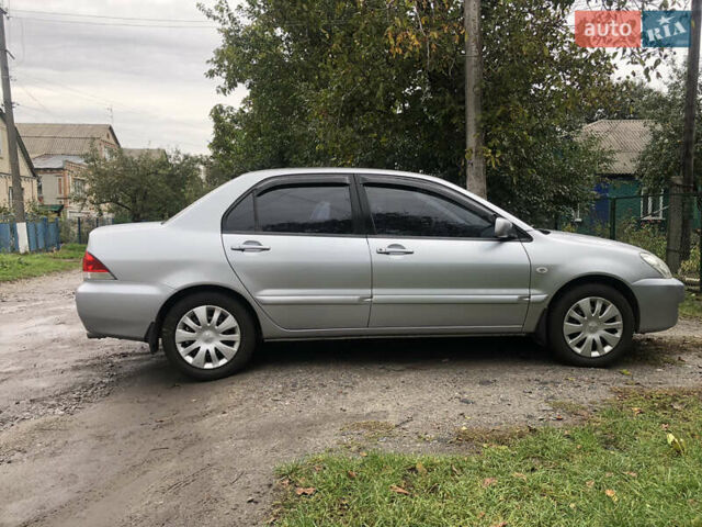 Сірий Міцубісі Lancer, об'ємом двигуна 1.58 л та пробігом 240 тис. км за 4299 $, фото 4 на Automoto.ua