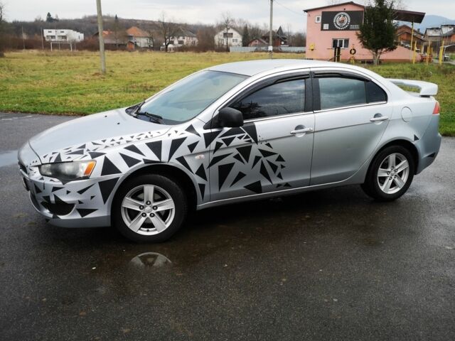 Серый Мицубиси Лансер, объемом двигателя 2 л и пробегом 260 тыс. км за 5200 $, фото 1 на Automoto.ua