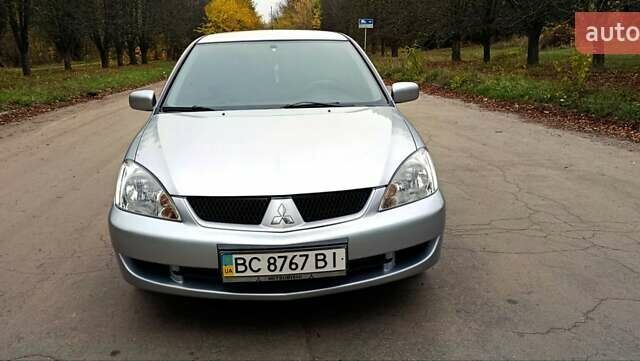Серый Мицубиси Лансер, объемом двигателя 1.58 л и пробегом 176 тыс. км за 5000 $, фото 7 на Automoto.ua