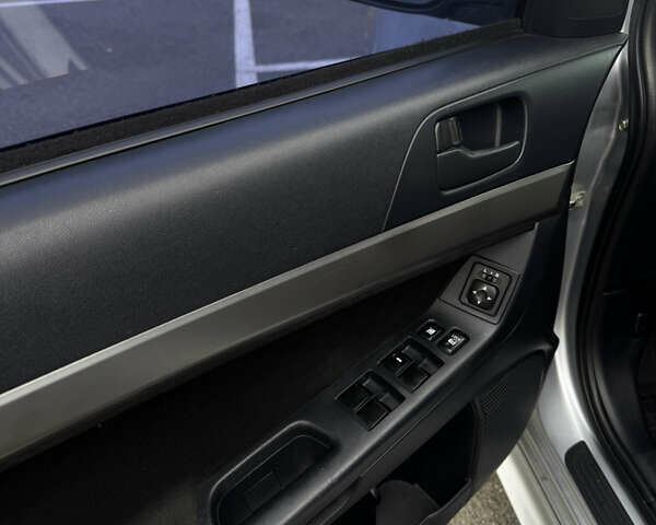 Сірий Міцубісі Lancer, об'ємом двигуна 2 л та пробігом 185 тис. км за 7000 $, фото 19 на Automoto.ua
