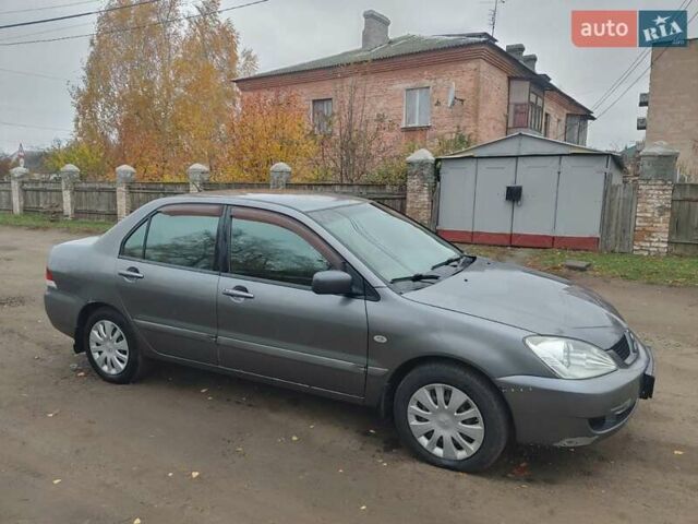 Сірий Міцубісі Lancer, об'ємом двигуна 1.58 л та пробігом 1 тис. км за 2850 $, фото 7 на Automoto.ua