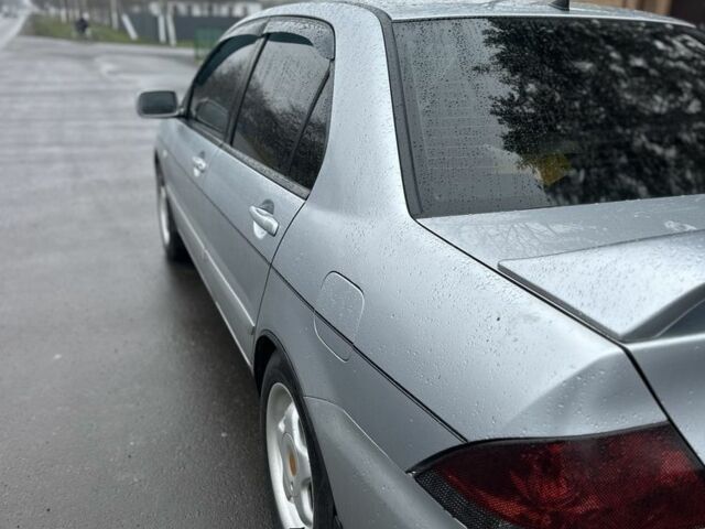 Сірий Міцубісі Lancer, об'ємом двигуна 1.6 л та пробігом 222 тис. км за 4300 $, фото 4 на Automoto.ua