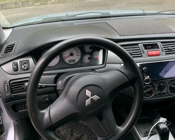 Мицубиси Лансер 2008 в Владимир-Волынский на Automoto.ua Серый Мицубиси Лансер, объемом двигателя 1.4 л и пробегом 268 тыс. км за 3700 $, фото 13 на Automoto.ua