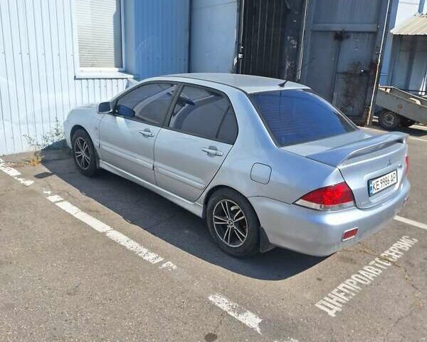 Сірий Міцубісі Lancer, об'ємом двигуна 1.6 л та пробігом 217 тис. км за 6000 $, фото 7 на Automoto.ua
