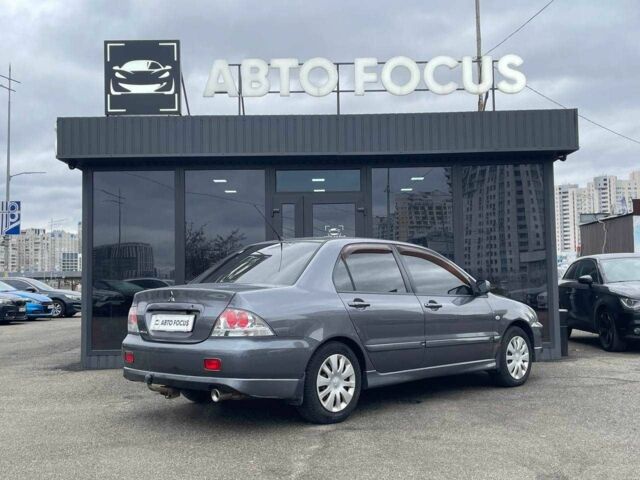 Серый Мицубиси Лансер, объемом двигателя 1.6 л и пробегом 146 тыс. км за 5990 $, фото 6 на Automoto.ua