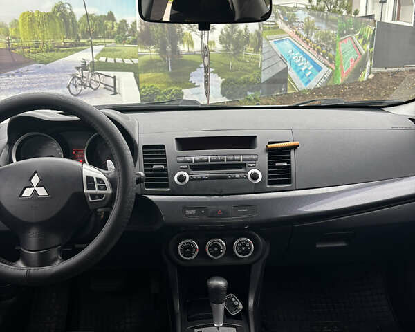 Серый Мицубиси Лансер, объемом двигателя 2 л и пробегом 211 тыс. км за 7100 $, фото 9 на Automoto.ua