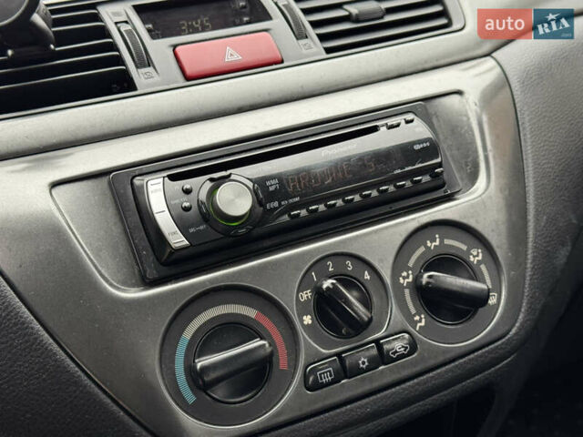 Сірий Міцубісі Lancer, об'ємом двигуна 1.6 л та пробігом 221 тис. км за 3650 $, фото 20 на Automoto.ua