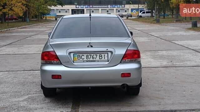 Сірий Міцубісі Lancer, об'ємом двигуна 1.6 л та пробігом 176 тис. км за 4999 $, фото 4 на Automoto.ua