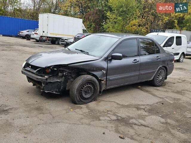 Сірий Міцубісі Lancer, об'ємом двигуна 1.58 л та пробігом 200 тис. км за 1700 $, фото 7 на Automoto.ua