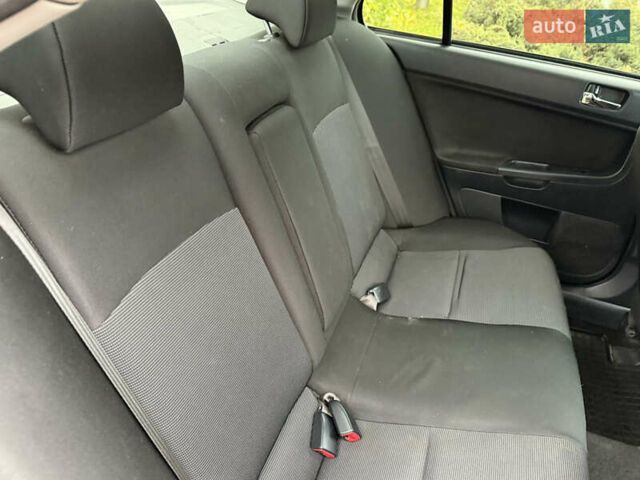 Сірий Міцубісі Lancer, об'ємом двигуна 2 л та пробігом 92 тис. км за 8200 $, фото 36 на Automoto.ua