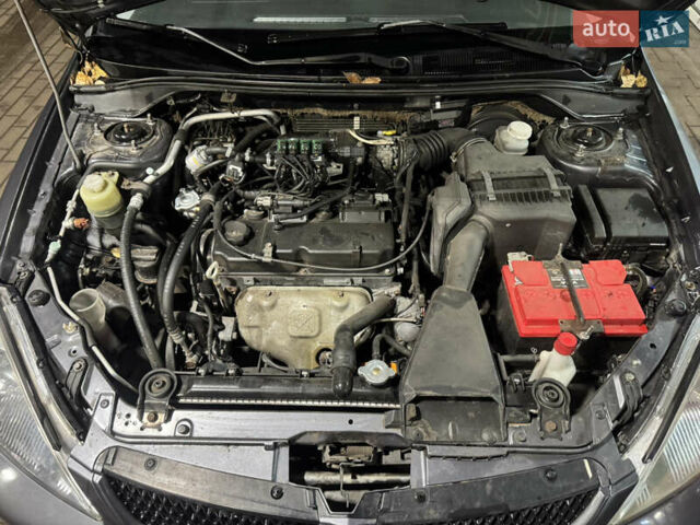Серый Мицубиси Лансер, объемом двигателя 1.6 л и пробегом 268 тыс. км за 4600 $, фото 11 на Automoto.ua
