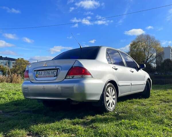Сірий Міцубісі Lancer, об'ємом двигуна 1.6 л та пробігом 364 тис. км за 4300 $, фото 1 на Automoto.ua