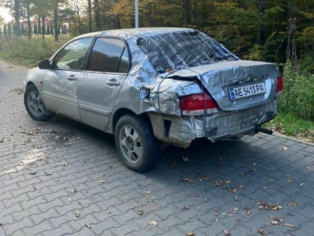 Серый Мицубиси Лансер, объемом двигателя 1.6 л и пробегом 140 тыс. км за 2500 $, фото 1 на Automoto.ua