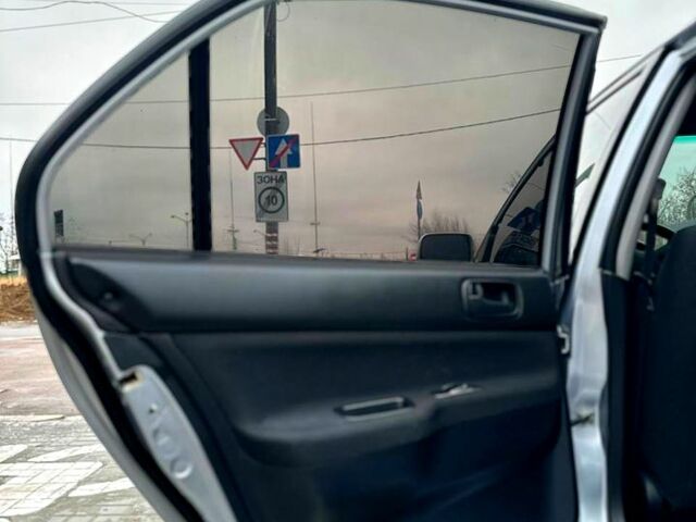 Серый Мицубиси Лансер, объемом двигателя 1.6 л и пробегом 165 тыс. км за 4000 $, фото 9 на Automoto.ua