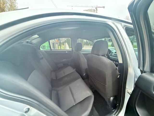 Серый Мицубиси Лансер, объемом двигателя 2 л и пробегом 210 тыс. км за 6500 $, фото 5 на Automoto.ua