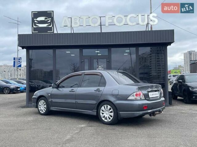 Серый Мицубиси Лансер, объемом двигателя 1.58 л и пробегом 146 тыс. км за 5490 $, фото 4 на Automoto.ua