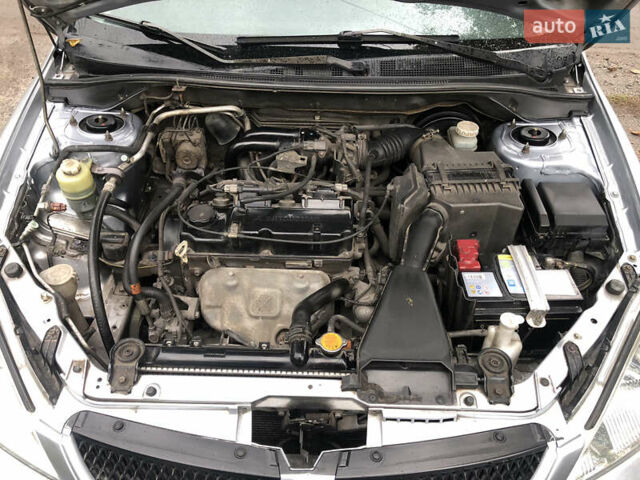 Сірий Міцубісі Lancer, об'ємом двигуна 1.58 л та пробігом 240 тис. км за 4299 $, фото 24 на Automoto.ua