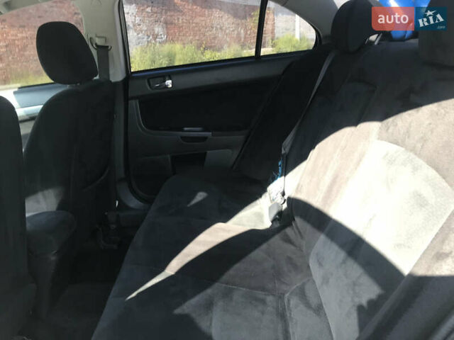 Серый Мицубиси Лансер, объемом двигателя 2 л и пробегом 256 тыс. км за 7000 $, фото 6 на Automoto.ua