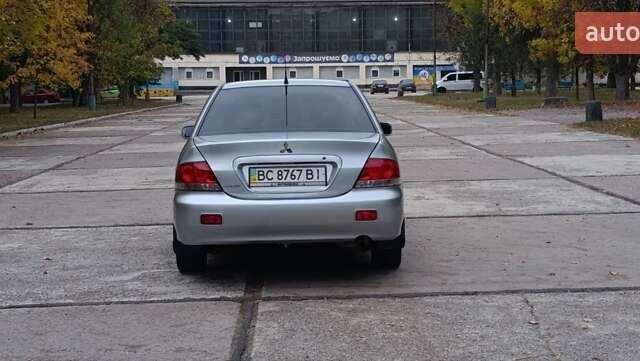 Сірий Міцубісі Lancer, об'ємом двигуна 1.6 л та пробігом 176 тис. км за 4999 $, фото 13 на Automoto.ua