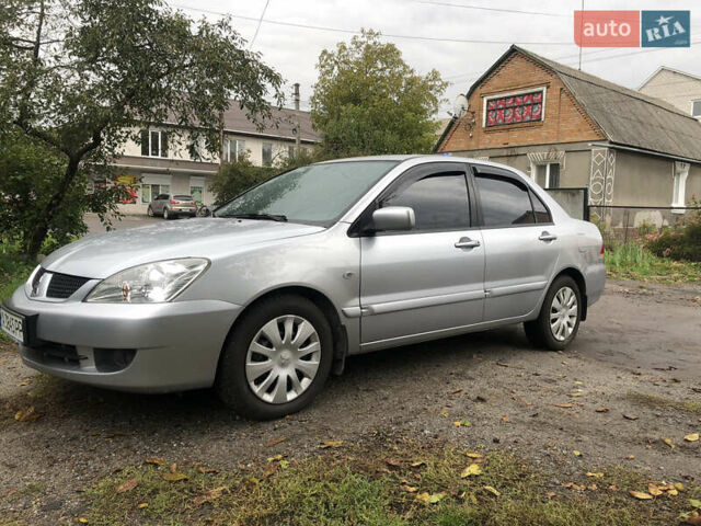Сірий Міцубісі Lancer, об'ємом двигуна 1.58 л та пробігом 240 тис. км за 4299 $, фото 10 на Automoto.ua
