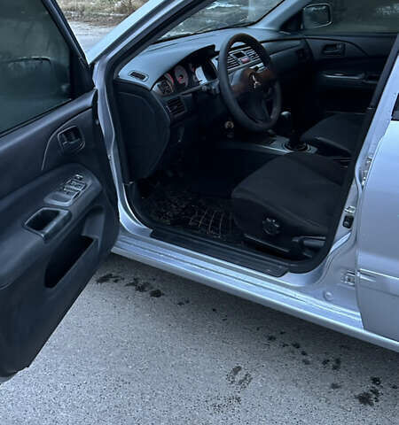 Сірий Міцубісі Lancer, об'ємом двигуна 1.58 л та пробігом 180 тис. км за 3900 $, фото 6 на Automoto.ua