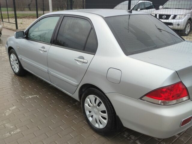 Серый Мицубиси Лансер, объемом двигателя 1.6 л и пробегом 225 тыс. км за 3100 $, фото 3 на Automoto.ua