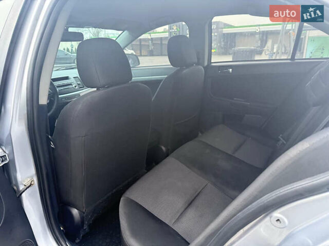 Серый Мицубиси Лансер, объемом двигателя 2 л и пробегом 220 тыс. км за 6500 $, фото 7 на Automoto.ua