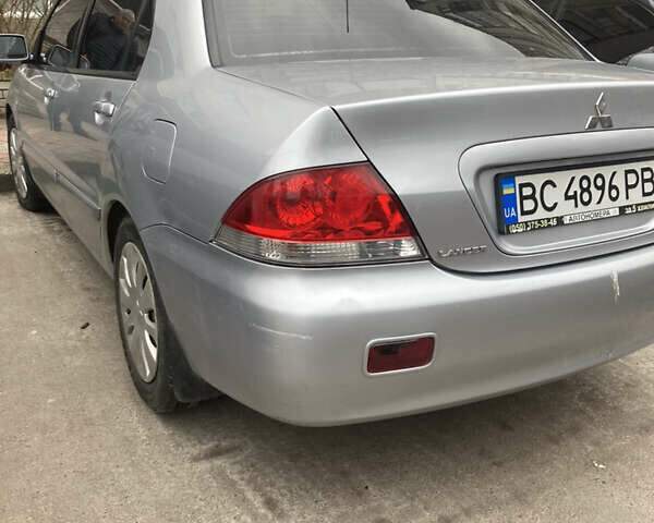 Сірий Міцубісі Lancer, об'ємом двигуна 1.58 л та пробігом 211 тис. км за 4400 $, фото 12 на Automoto.ua