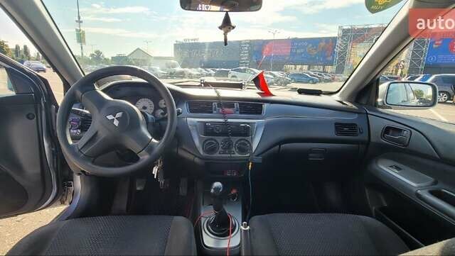 Серый Мицубиси Лансер, объемом двигателя 1.6 л и пробегом 257 тыс. км за 4500 $, фото 2 на Automoto.ua