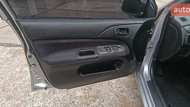 Сірий Міцубісі Lancer, об'ємом двигуна 1.6 л та пробігом 176 тис. км за 4999 $, фото 28 на Automoto.ua