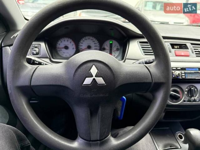 Сірий Міцубісі Lancer, об'ємом двигуна 1.6 л та пробігом 206 тис. км за 4799 $, фото 12 на Automoto.ua