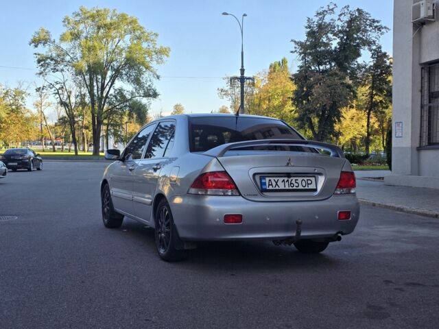 Серый Мицубиси Лансер, объемом двигателя 1.6 л и пробегом 150 тыс. км за 4700 $, фото 3 на Automoto.ua
