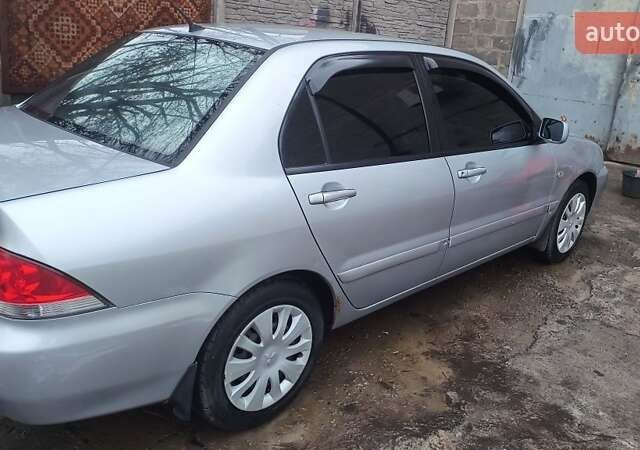 Серый Мицубиси Лансер, объемом двигателя 1.6 л и пробегом 320 тыс. км за 4167 $, фото 2 на Automoto.ua