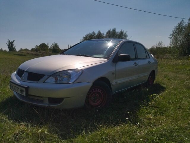 Серый Мицубиси Лансер, объемом двигателя 1.6 л и пробегом 350 тыс. км за 3600 $, фото 7 на Automoto.ua