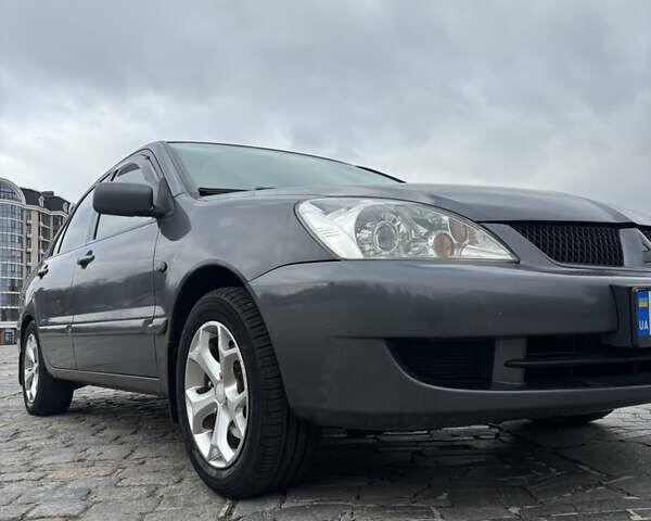 Серый Мицубиси Лансер, объемом двигателя 1.6 л и пробегом 222 тыс. км за 5200 $, фото 2 на Automoto.ua