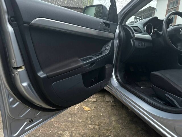 Серый Мицубиси Лансер, объемом двигателя 1.5 л и пробегом 147 тыс. км за 6700 $, фото 12 на Automoto.ua