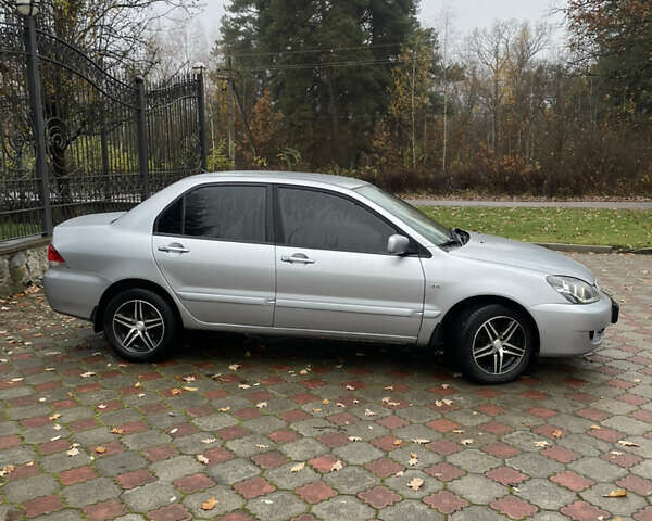 Сірий Міцубісі Lancer, об'ємом двигуна 1.59 л та пробігом 219 тис. км за 4500 $, фото 4 на Automoto.ua