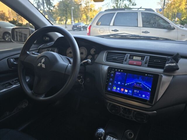 Серый Мицубиси Лансер, объемом двигателя 1.6 л и пробегом 150 тыс. км за 4700 $, фото 6 на Automoto.ua