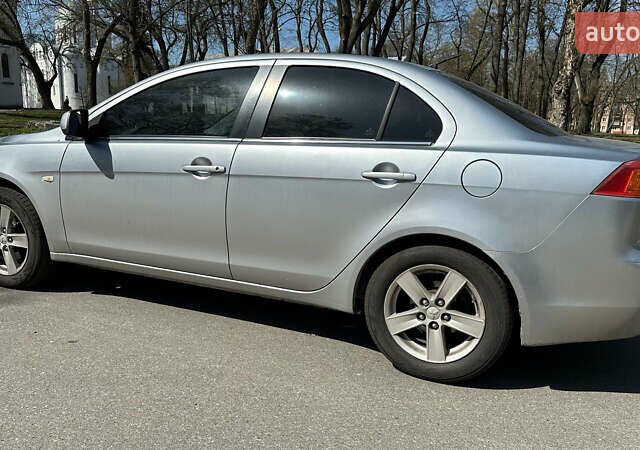 Сірий Міцубісі Lancer, об'ємом двигуна 1.8 л та пробігом 255 тис. км за 6999 $, фото 2 на Automoto.ua