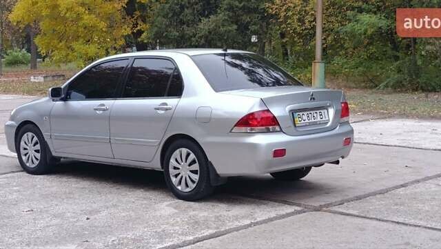 Сірий Міцубісі Lancer, об'ємом двигуна 1.6 л та пробігом 176 тис. км за 4999 $, фото 10 на Automoto.ua