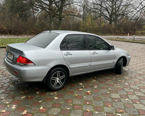 Сірий Міцубісі Lancer, об'ємом двигуна 1.59 л та пробігом 219 тис. км за 4500 $, фото 5 на Automoto.ua