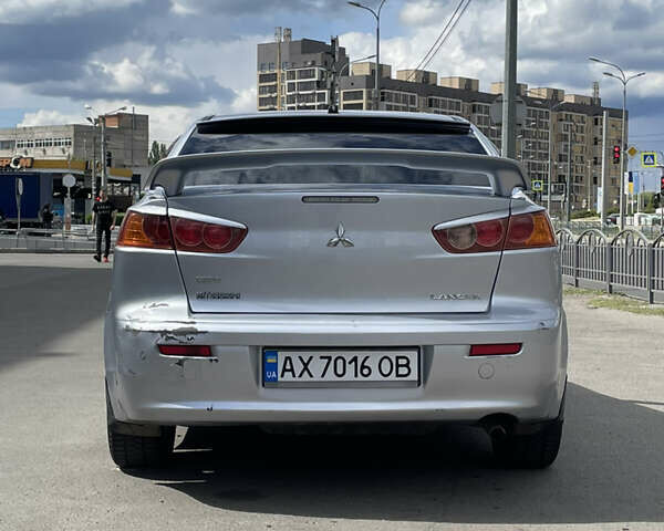 Серый Мицубиси Лансер, объемом двигателя 2 л и пробегом 265 тыс. км за 5500 $, фото 9 на Automoto.ua