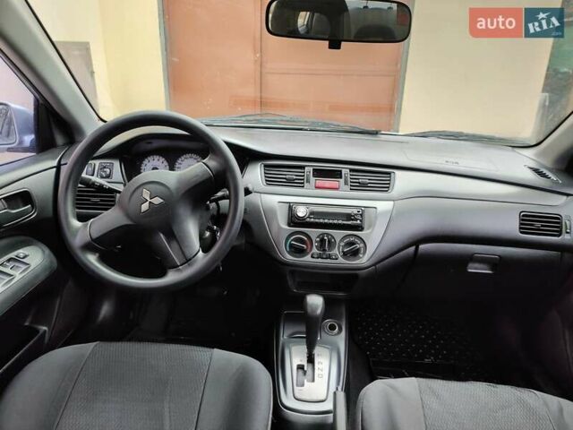 Серый Мицубиси Лансер, объемом двигателя 1.58 л и пробегом 185 тыс. км за 4700 $, фото 10 на Automoto.ua