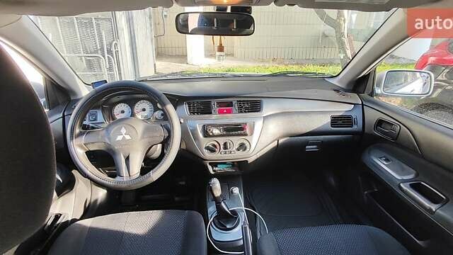 Серый Мицубиси Лансер, объемом двигателя 1.58 л и пробегом 216 тыс. км за 4700 $, фото 6 на Automoto.ua
