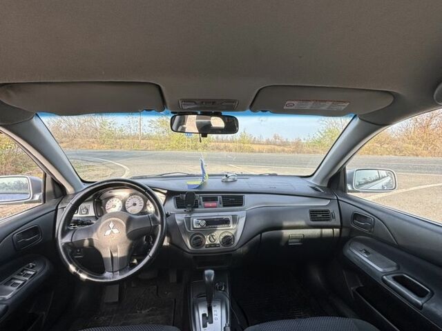 Серый Мицубиси Лансер, объемом двигателя 1.6 л и пробегом 228 тыс. км за 4500 $, фото 4 на Automoto.ua